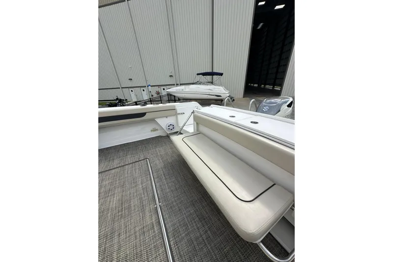  Yacht Photos Pics 2020 Stamas 326 Aegean boat interior with seating and storage, docked in a marina.