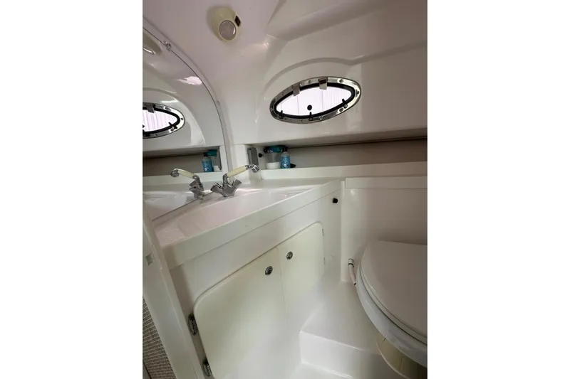 Yacht Photos Pics 2020 Stamas 326 Aegean boat bathroom interior with sink and porthole window.
