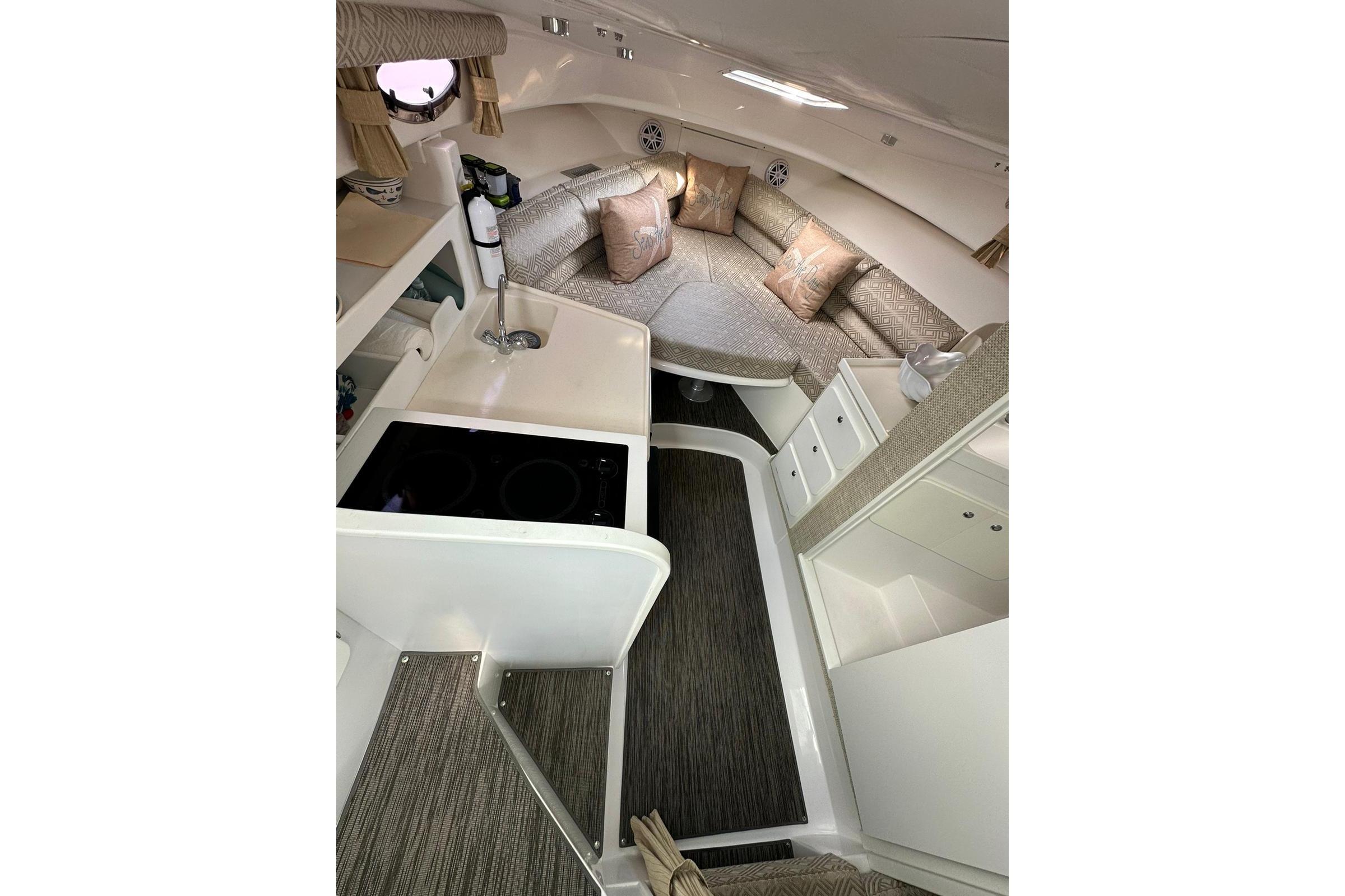 2020 Stamas 326 Aegean boat interior with modern kitchen and cozy seating area.