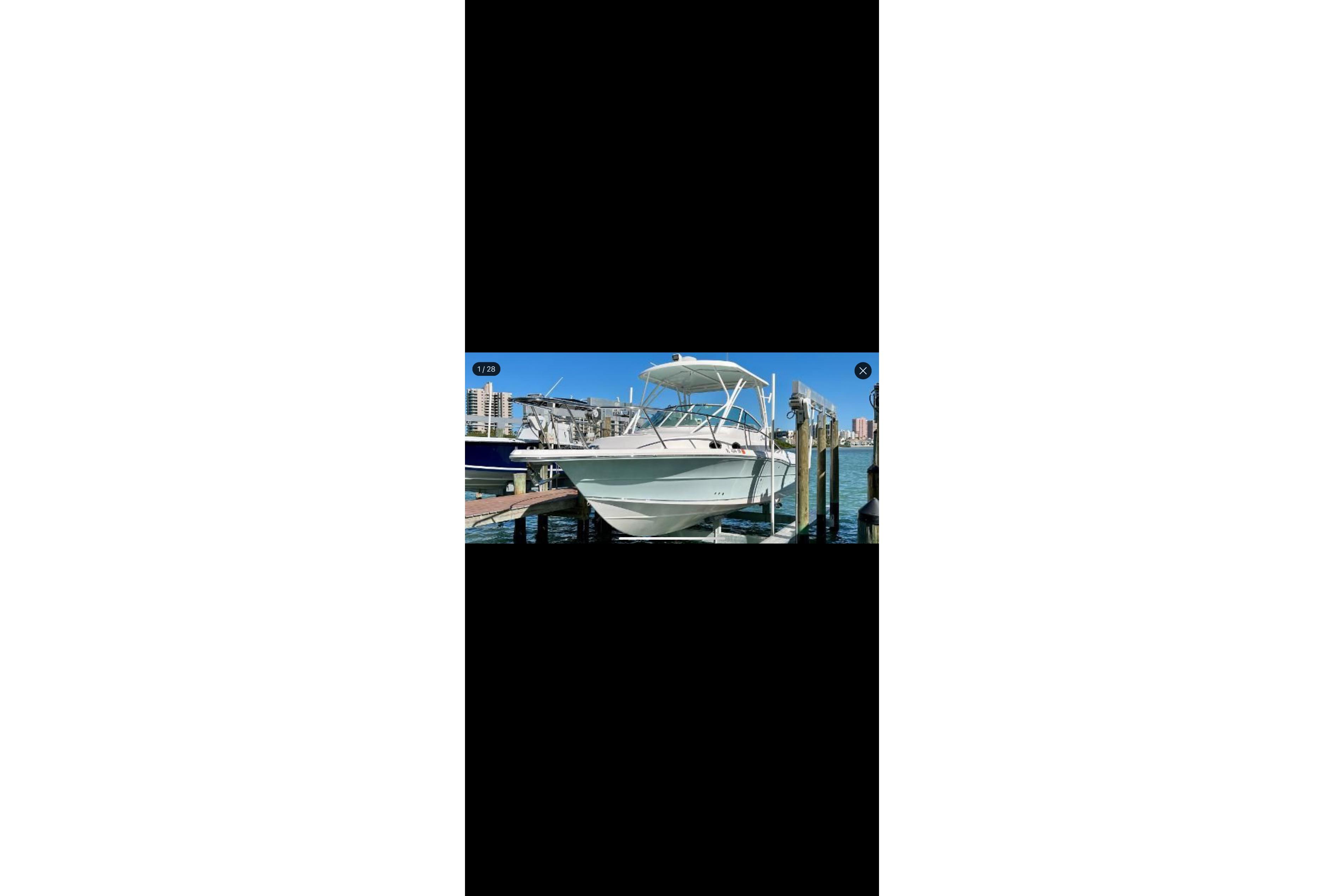 2020 Stamas 326 Aegean boat docked in a marina under clear blue skies.