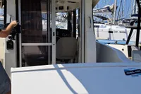 2022 Quicksilver 705 Pilothouse boat with 150 horsepower engine, docked at marina.