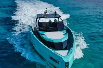  Yacht Photos Pics 2024 Suerte 50 yacht cruising on clear blue ocean waters.