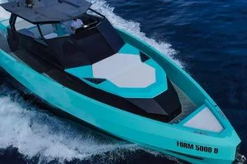  Yacht Photos Pics 2024 Suerte 50 yacht cruising on blue ocean waters, showcasing sleek design and modern features.