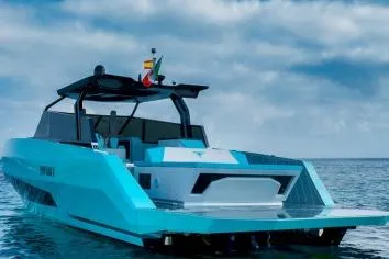  Yacht Photos Pics 2024 Suerte 50 yacht on open water under cloudy sky.