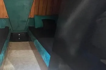  Yacht Photos Pics Interior of 2024 Suerte 50, featuring cozy seating and modern design elements.