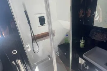 Yacht Photos Pics Modern bathroom in 2024 Suerte 50 yacht with shower and sink.