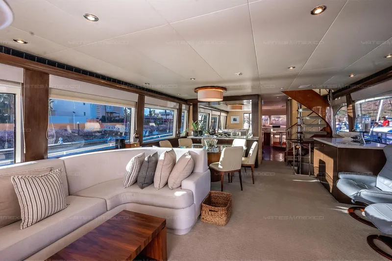 Mijito Yacht Photos Pics Luxurious yacht interior with elegant seating, dining area, and panoramic windows, Bravo 82 model, 2002.