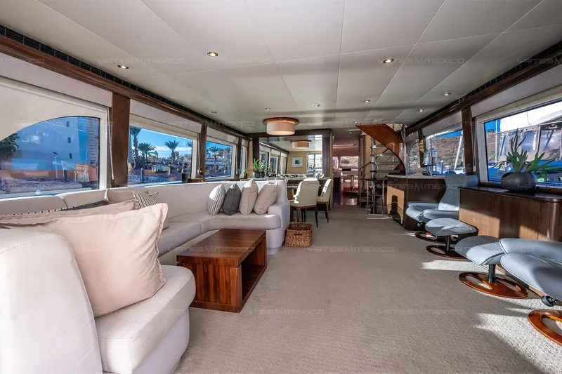 Mijito Yacht Photos Pics Luxurious yacht interior with elegant seating, Bravo 82 model, 2002, featuring panoramic windows and modern decor.