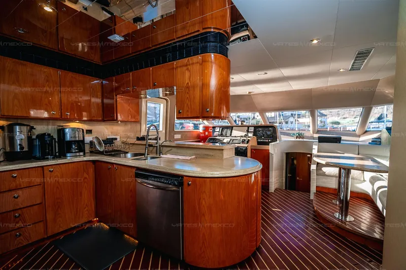 Mijito Yacht Photos Pics Luxurious yacht interior with modern kitchen and dining area, Bravo 82 model, 2002.