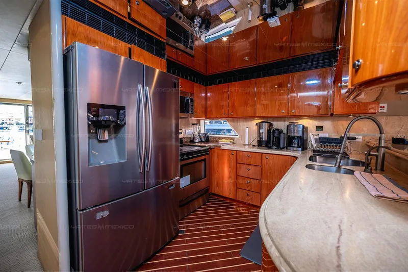 Mijito Yacht Photos Pics Luxurious yacht kitchen with stainless steel appliances, wooden cabinets, and modern amenities, Bravo 82, 2002.