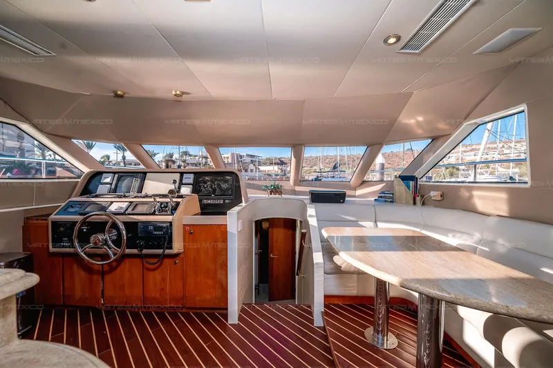 Mijito Yacht Photos Pics Luxurious 2002 Bravo 82 yacht interior with helm, seating, and panoramic windows.