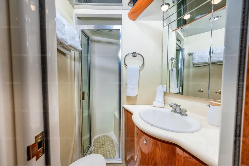 Mijito Yacht Photos Pics Luxurious yacht bathroom with shower, sink, and mirror, Bravo 82 model, 2002.