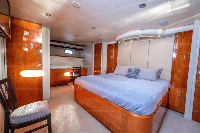 Mijito Yacht Photos Pics Luxurious yacht bedroom with wooden furnishings, Bravo 82 model, 2002.