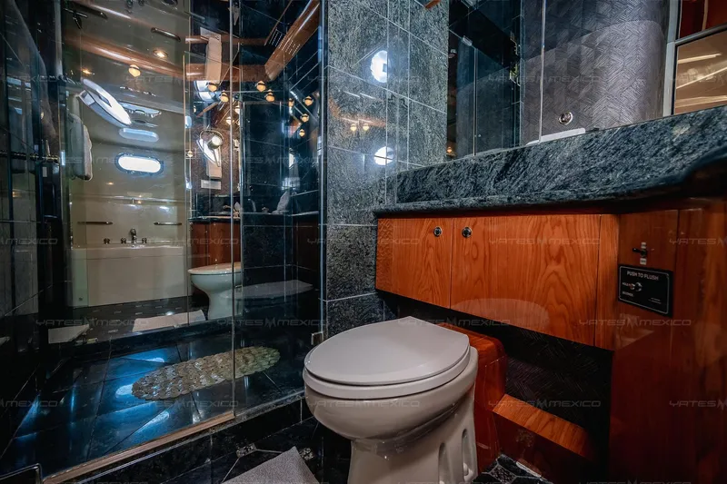 Mijito Yacht Photos Pics Luxurious yacht bathroom with marble accents, wooden cabinetry, and modern fixtures, Bravo 82 model 2002.