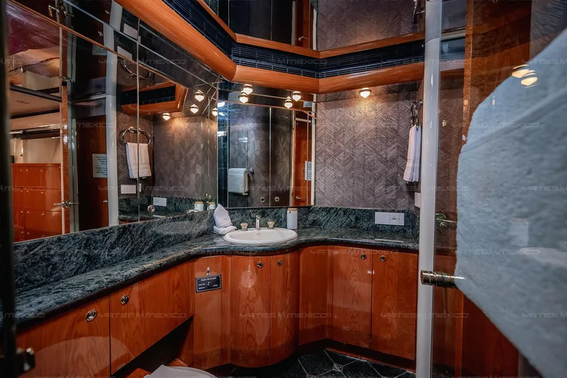 Mijito Yacht Photos Pics Luxurious yacht bathroom with marble countertops, wooden cabinets, and elegant lighting, Bravo 82 model, 2002.