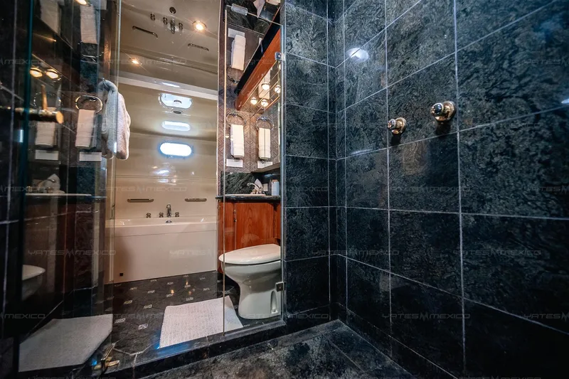 Mijito Yacht Photos Pics Luxurious yacht bathroom with marble tiles, featuring a bathtub and modern fixtures, Bravo 82, 2002.