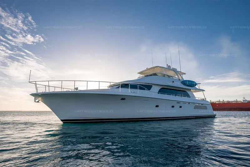 Mijito Yacht Photos Pics Luxurious 2002 Bravo 82 yacht on calm ocean waters at sunset.