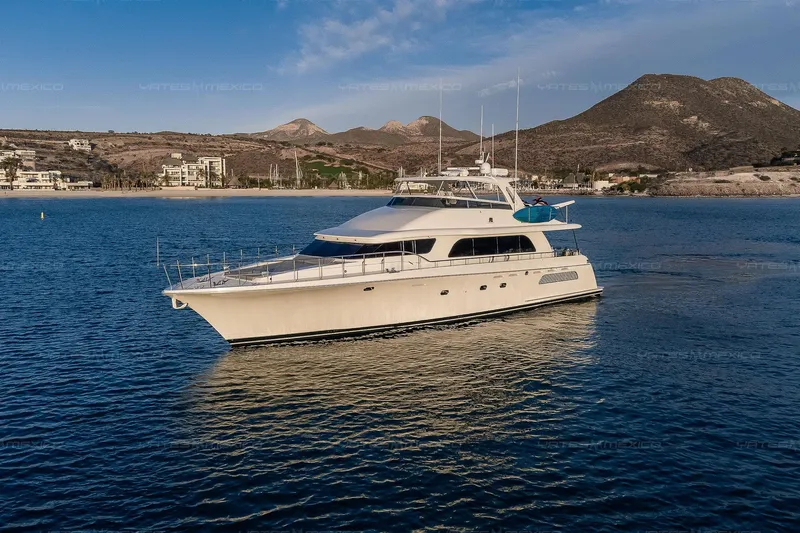 Mijito Yacht Photos Pics Luxurious 2002 Bravo 82 yacht cruising on serene waters with scenic mountain backdrop.