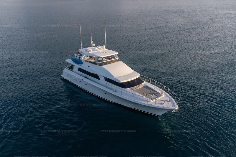 Mijito Yacht Photos Pics Luxurious 2002 Bravo 82 yacht cruising on calm ocean waters.