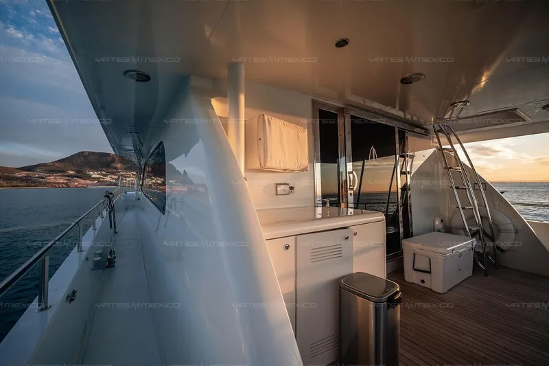 Mijito Yacht Photos Pics Luxurious Bravo 82 yacht deck with ocean view at sunset, 2002 model.