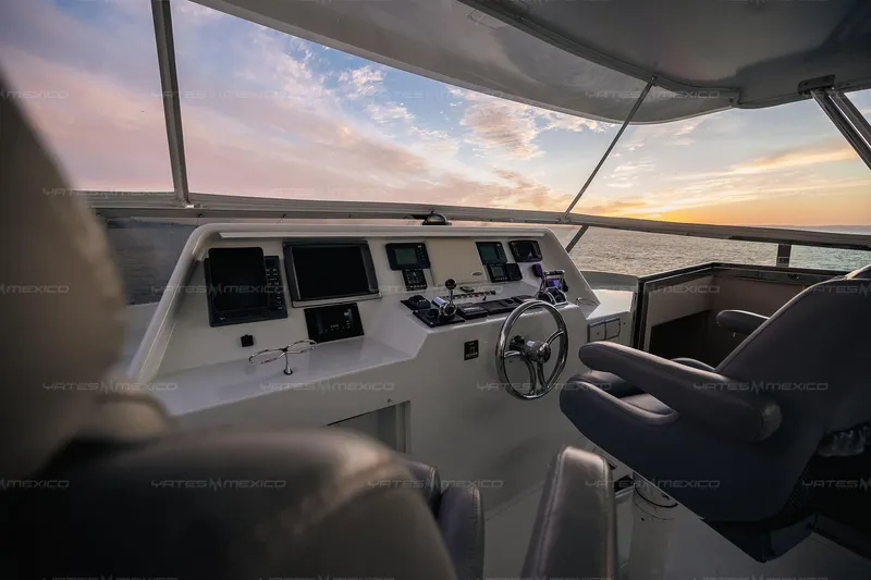 Mijito Yacht Photos Pics Pilot area of 2002 Bravo 82 yacht at sunset, featuring modern navigation equipment.