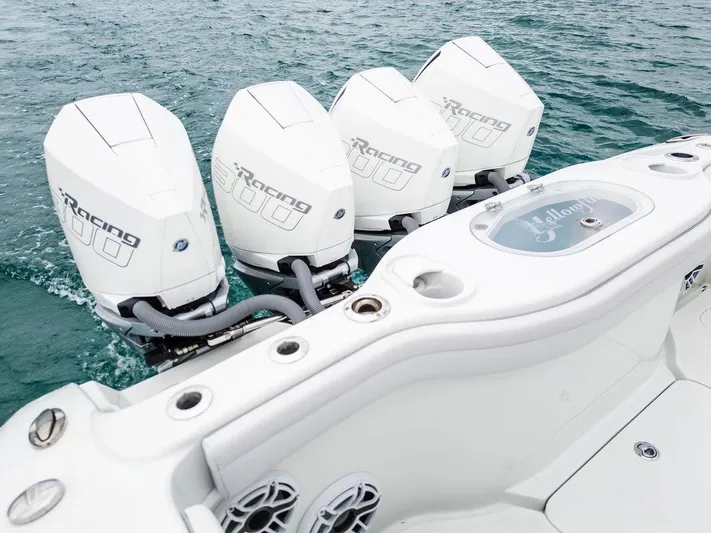  Yacht Photos Pics 2019 Yellowfin 42 boat with four powerful outboard engines on the water.