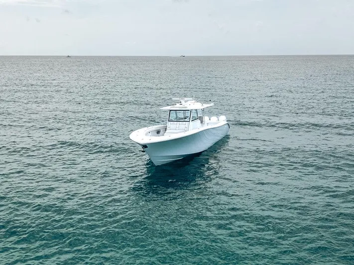  Yacht Photos Pics 2019 Yellowfin 42 boat on open sea, calm waters, overcast sky.