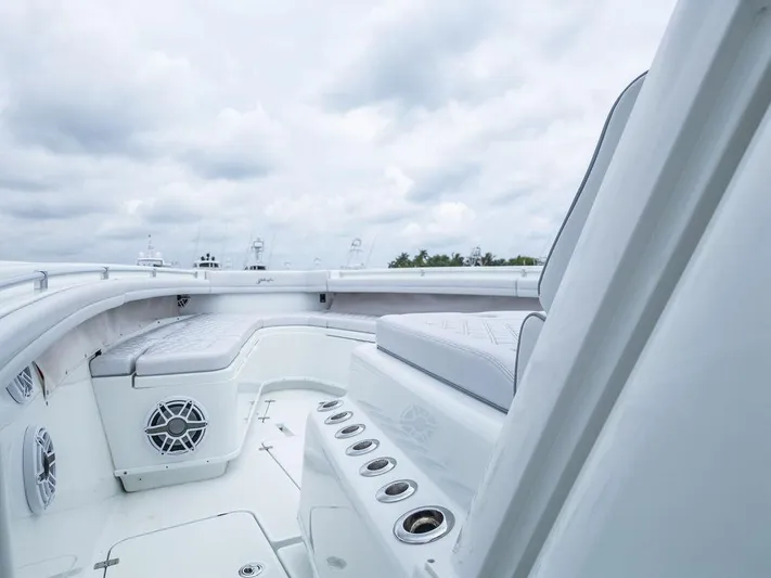  Yacht Photos Pics 2019 Yellowfin 42 boat interior with cushioned seating and rod holders.