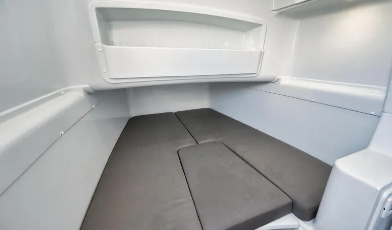  Yacht Photos Pics 2019 Yellowfin 42 interior cabin with gray cushions and white walls.