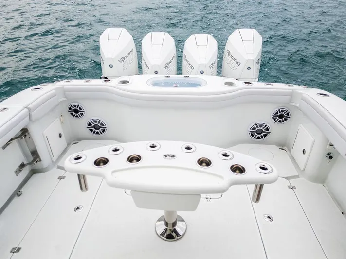  Yacht Photos Pics 2019 Yellowfin 42 boat with multiple outboard engines and fishing rod holders.