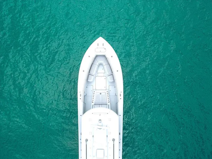  Yacht Photos Pics Aerial view of 2019 Yellowfin 42 boat on turquoise water.