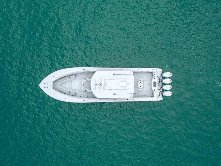  Yacht Photos Pics Aerial view of 2019 Yellowfin 42 boat on turquoise water.