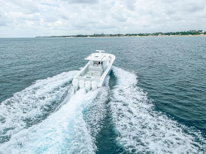  Yacht Photos Pics 2019 Yellowfin 42 boat cruising on open ocean with wake trails.