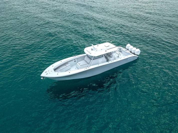  Yacht Photos Pics 2019 Yellowfin 42 boat on clear blue water, aerial view.