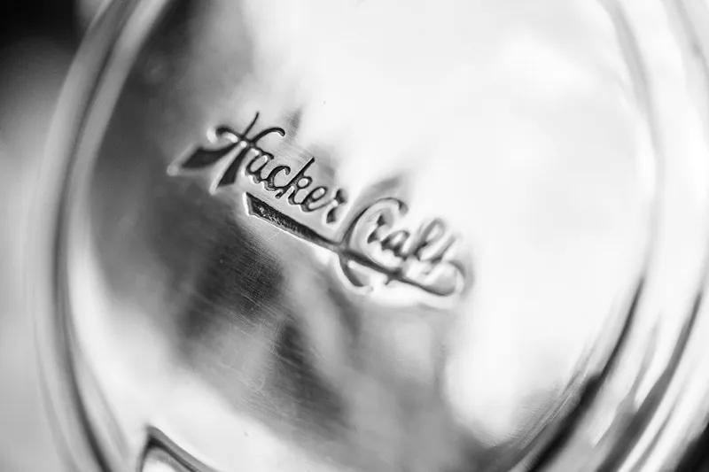 Liberty 1776 Yacht Photos Pics Close-up of 2007 Hacker-Craft 32 Sportabout logo on metallic surface.