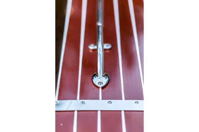 Liberty 1776 Yacht Photos Pics Close-up of 2007 Hacker-Craft 32 Sportabout's polished wood deck with chrome details.