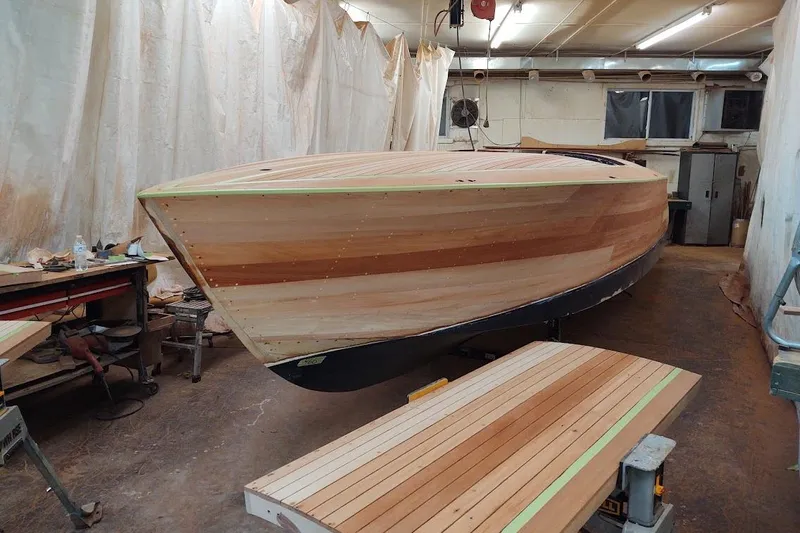 Liberty 1776 Yacht Photos Pics 2007 Hacker-Craft 32 Sportabout boat under construction in a workshop.