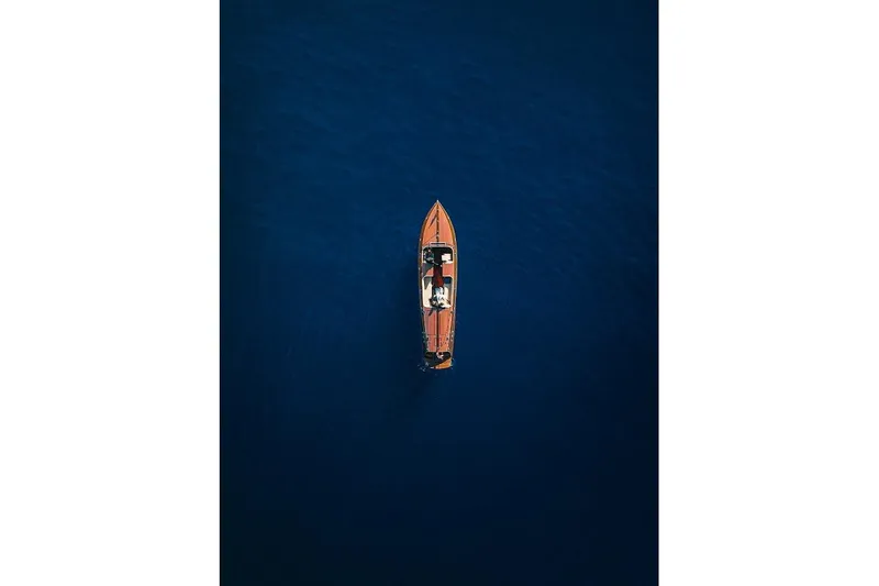 Liberty 1776 Yacht Photos Pics Aerial view of 2007 Hacker-Craft 32 Sportabout on deep blue water.