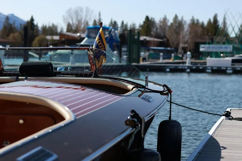 Liberty 1776 Yacht Photos Pics 2007 Hacker-Craft 32 Sportabout boat docked at a marina, showcasing elegant wooden design.
