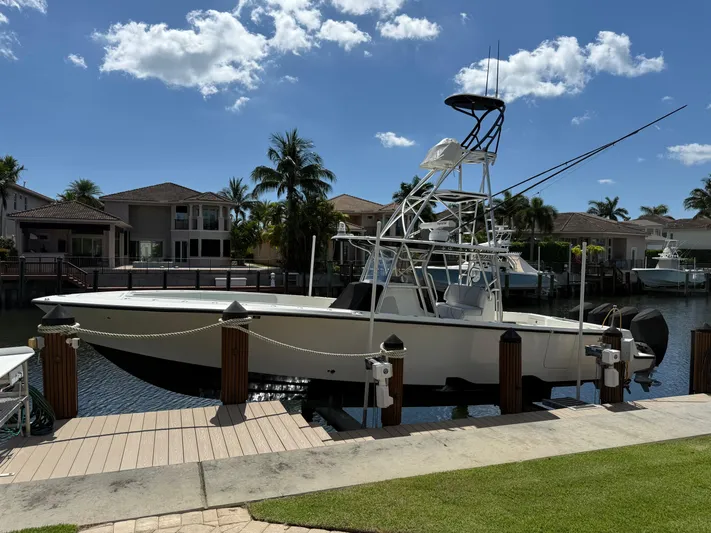  Yacht Photos Pics 2018 SeaVee 390Z boat docked in a sunny waterfront neighborhood.