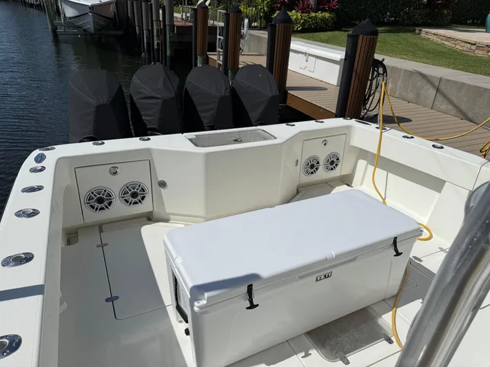  Yacht Photos Pics 2018 SeaVee 390Z boat deck with cooler, speakers, and docked engines.