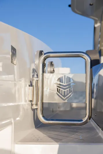  Yacht Photos Pics Stainless steel railing on 2025 Canados 571 yacht against clear blue sky.