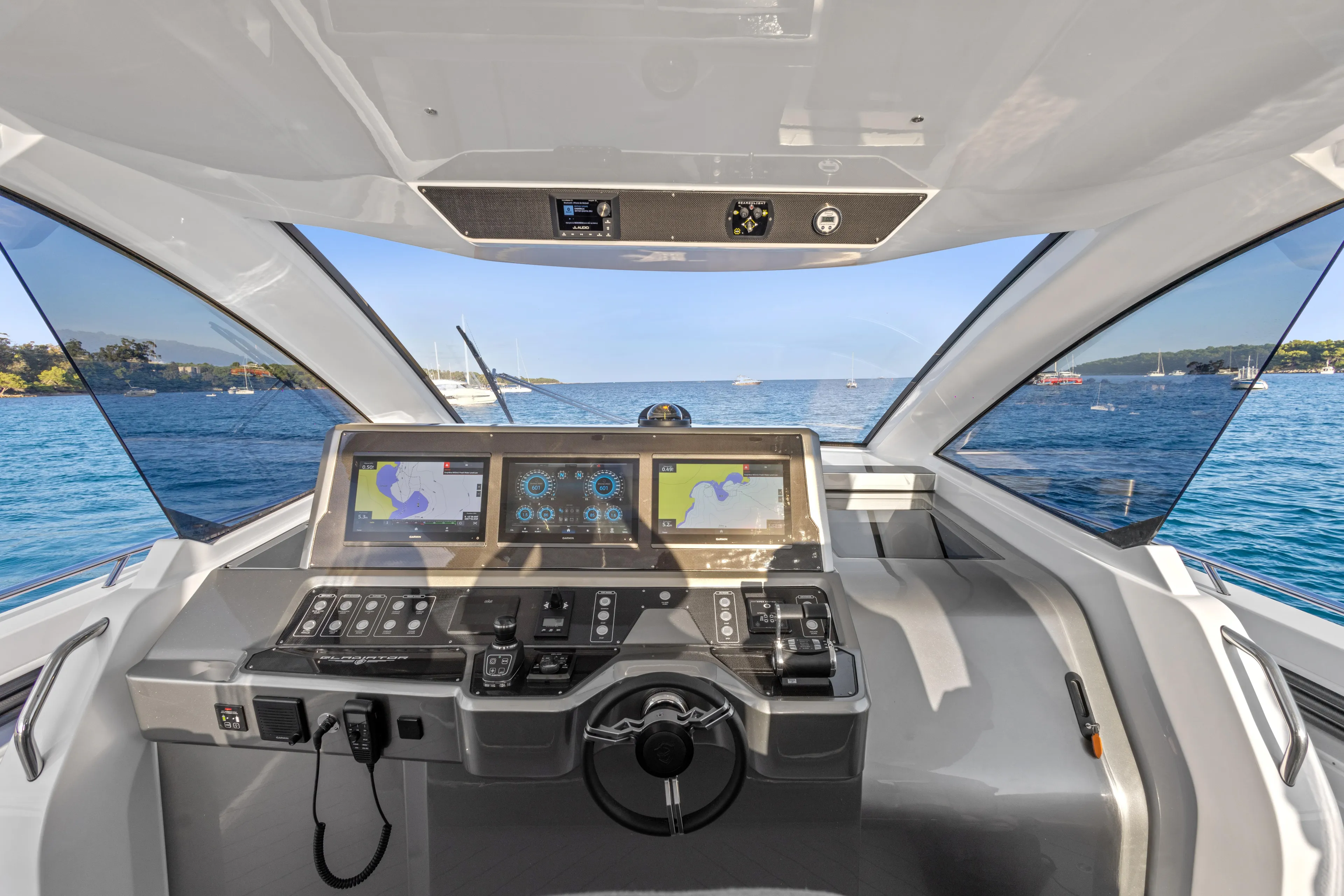  Yacht Photos Pics 2025 Canados 571 yacht cockpit with advanced navigation systems, overlooking serene blue waters.