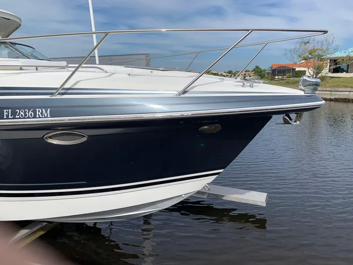 The Great Escape Yacht Photos Pics 2017 Formula 34 Cruiser boat docked on calm water.