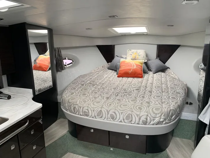 The Great Escape Yacht Photos Pics 2017 Formula 34 Cruiser cabin with a cozy bed and modern interior.