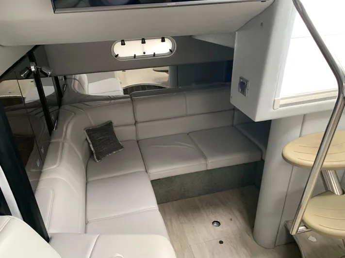 The Great Escape Yacht Photos Pics Interior of 2017 Formula 34 Cruiser with white leather seating and modern design.