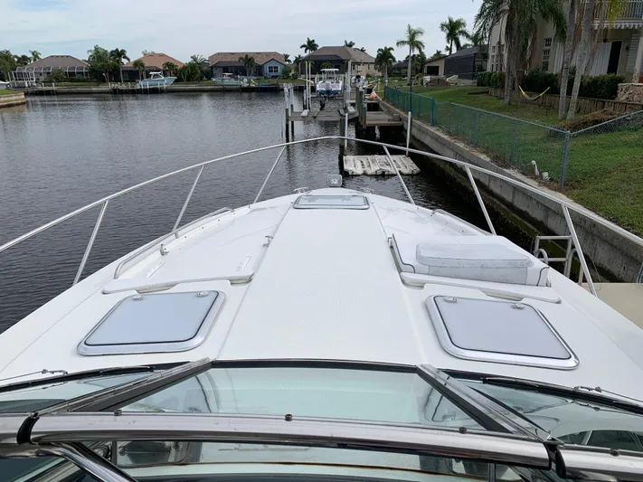 The Great Escape Yacht Photos Pics 2017 Formula 34 Cruiser yacht docked in a residential canal.