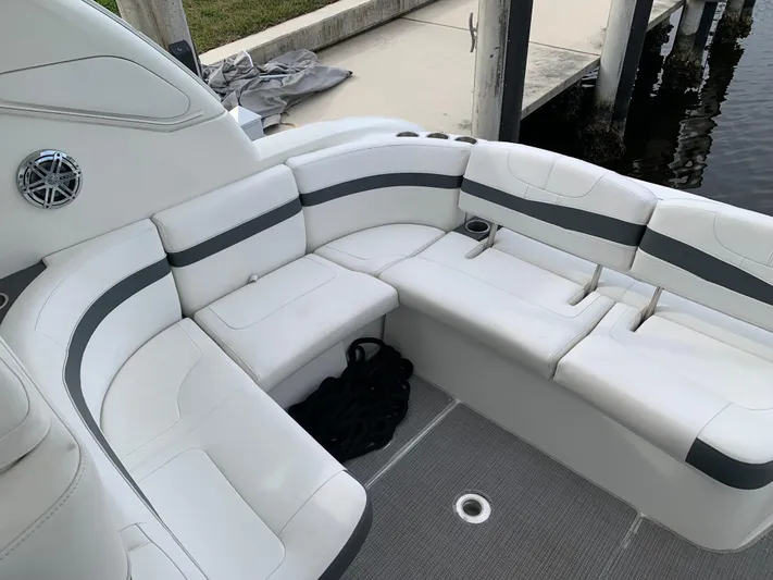 The Great Escape Yacht Photos Pics 2017 Formula 34 Cruiser boat with white and gray seating at the dock.