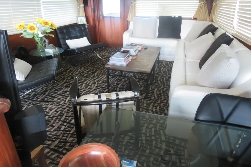 Rive' Gauche Yacht Photos Pics Luxurious interior of a 1986 Hatteras 58 Motor Yacht with elegant seating and decor.