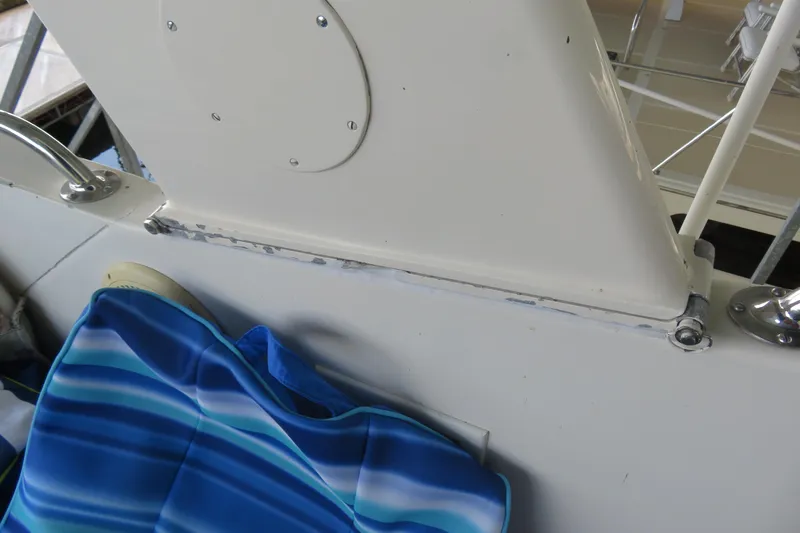 Rive' Gauche Yacht Photos Pics 1986 Hatteras 58 Motor Yacht deck detail with blue-striped cushion.